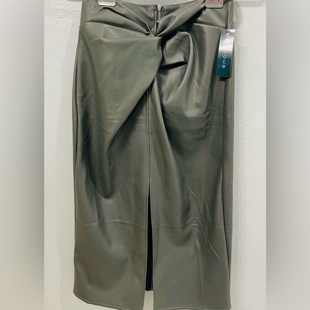 Kirious olive green knot front , faux leather skirt. women’s size M